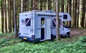 motorhome parked in a wood