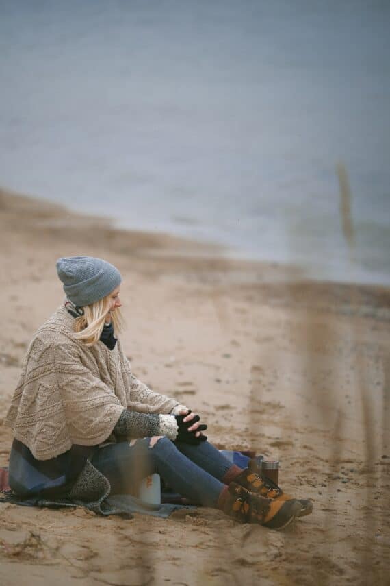woman sitting on a beach